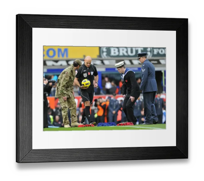 Framed Print : Remembrance Sunday at Goodison Park: Everton and Arsenal Players Honor Fallen Heroes Before Premier League Match (14 November 2010)