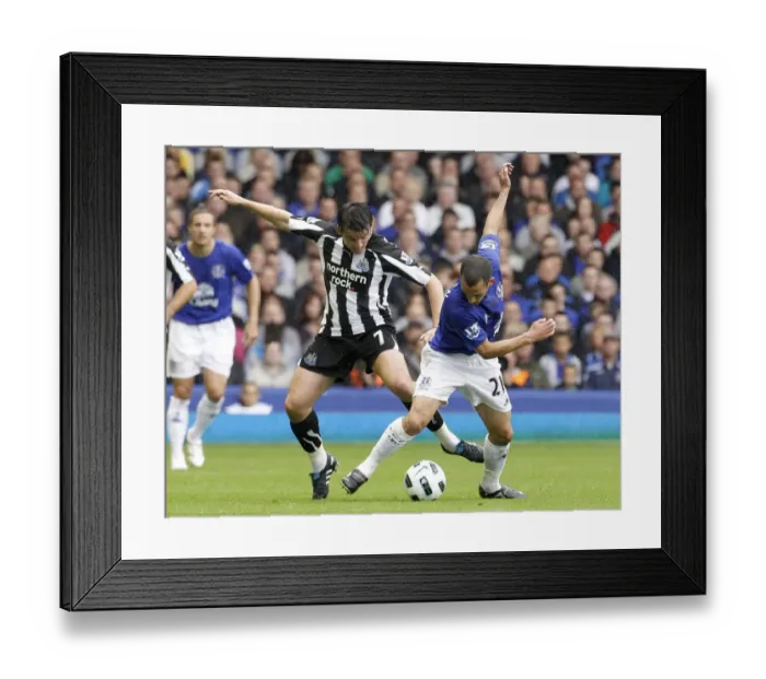 Framed Print : Clash at Goodison Park: Leon Osman vs. Joey Barton - Everton vs. Newcastle United (18 September 2010) Framed Print : Clash at Goodison Park: Leon Osman vs. Joey Barton - Everton vs. Newcastle United (18 September 2010)