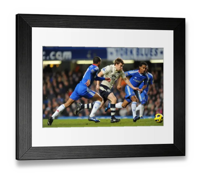 Framed Print : Clash at Stamford Bridge: Seamus Coleman Stands Firm Against Chelsea's Ashley Cole and Florent Malouda