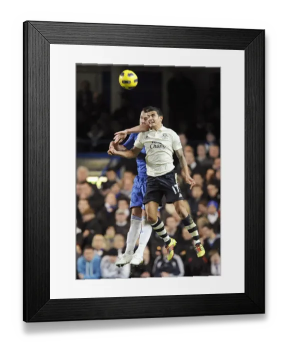 Framed Print : Clash of Titans: John Terry vs. Tim Cahill - Chelsea vs. Everton, Premier League Showdown (4 December 2010, Stamford Bridge) Framed Print : Clash of Titans: John Terry vs. Tim Cahill - Chelsea vs. Everton, Premier League Showdown (4 December 2010, Stamford Bridge)