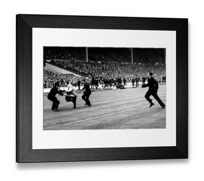 Framed Print : Everton's Unforgettable FA Cup Final: A Fan's Defiant Moment Amidst Three Policemen (1966) Framed Print : Everton's Unforgettable FA Cup Final: A Fan's Defiant Moment Amidst Three Policemen (1966)