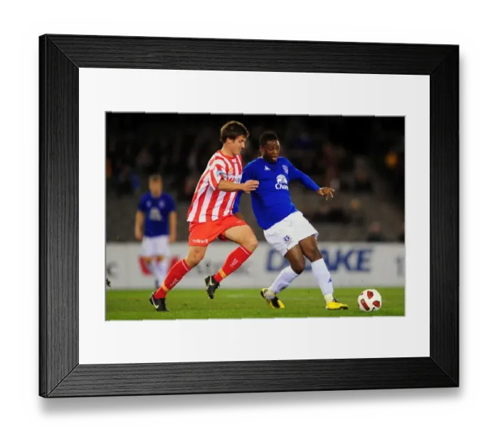 Framed Print : Magaye Gueye vs. Michael Marrone: A Tight Battle for Possession