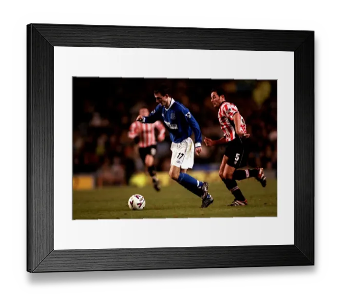 Framed Print : Everton's Francis Jeffers Slips Past Exeter City's Chris Curran in FA Cup Third Round Replay Thriller Framed Print : Everton's Francis Jeffers Slips Past Exeter City's Chris Curran in FA Cup Third Round Replay Thriller
