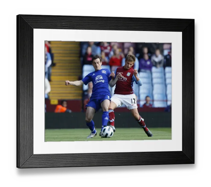 Framed Print : Baines vs Albrighton: A Football Showdown - Everton's Leighton Baines and Aston Villa's Marc Albrighton Clash for Ball Possession