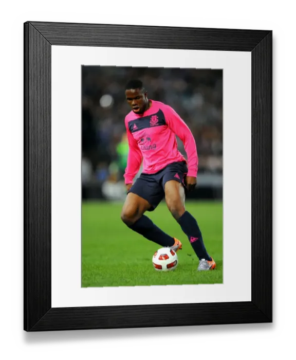 Framed Print : Powerful Striker: Victor Anichebe in Action for Everton FC Framed Print : Powerful Striker: Victor Anichebe in Action for Everton FC