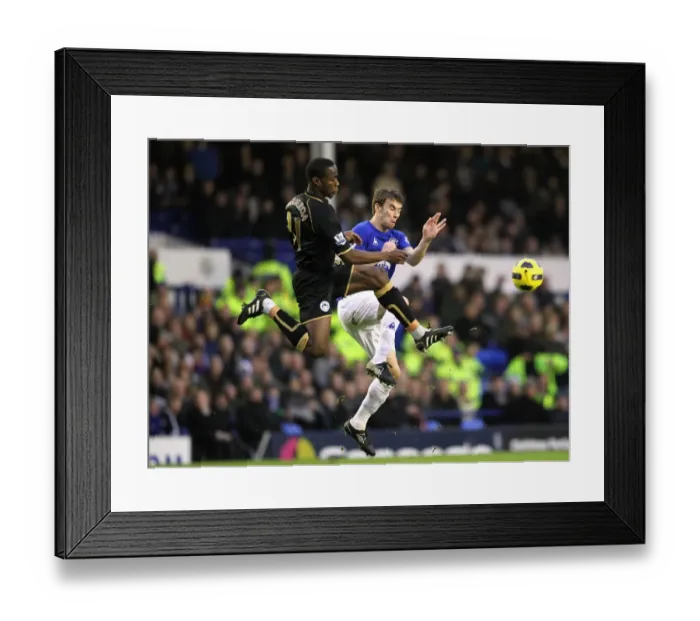 Framed Print : Figueroa vs. Coleman: A Battle for Supremacy at Goodison Park - Everton vs. Wigan Athletic, Barclays Premier League (December 11, 2010) Framed Print : Figueroa vs. Coleman: A Battle for Supremacy at Goodison Park - Everton vs. Wigan Athletic, Barclays Premier League (December 11, 2010)