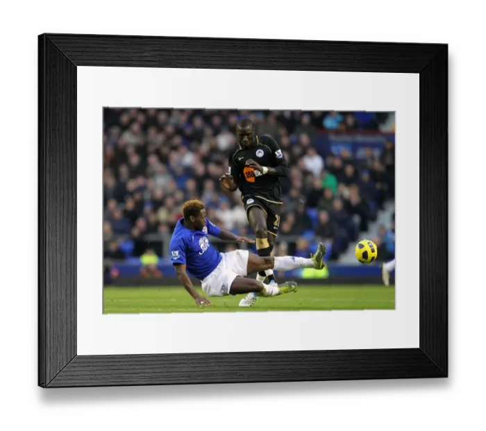 Framed Print : Everton vs Wigan Athletic: A Battle at Goodison Park - Louis Saha vs Mohamed Diame: Clash of the Midfield Titans Framed Print : Everton vs Wigan Athletic: A Battle at Goodison Park - Louis Saha vs Mohamed Diame: Clash of the Midfield Titans