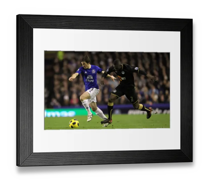 Framed Print : Battle for the Ball: Leighton Baines vs. Steve Gohouri - Everton vs. Wigan Athletic, Premier League (11 December 2010)