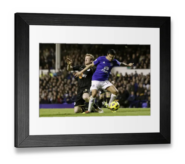 Framed Print : Battle for the Ball: Tim Cahill vs Steven Caldwell - Everton vs Wigan Athletic (Premier League, Goodison Park, 11 December 2010)