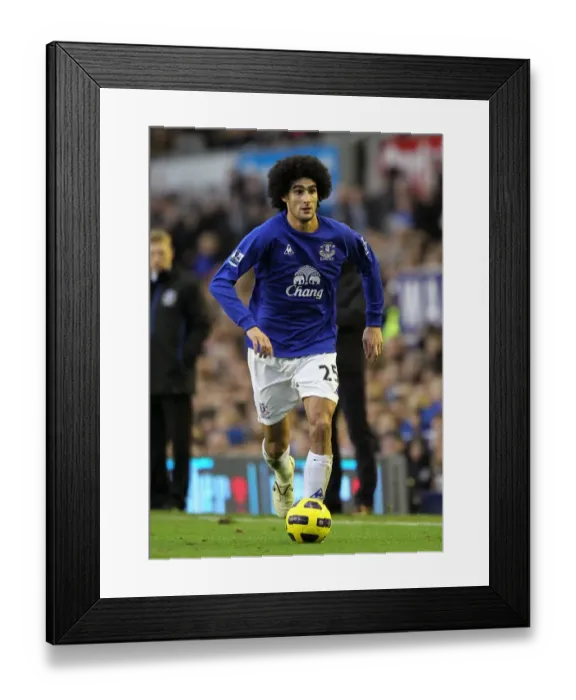 Framed Print : Marouane Fellaini: Thunderous Performance at Goodison Park - Everton vs. Wigan Athletic (11 December 2010) Framed Print : Marouane Fellaini: Thunderous Performance at Goodison Park - Everton vs. Wigan Athletic (11 December 2010)