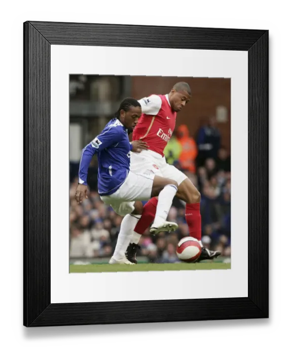 Framed Print : Evertons Fernandes challenges Arsenals Baptista for the ball during their English Premier League s Framed Print : Evertons Fernandes challenges Arsenals Baptista for the ball during their English Premier League s