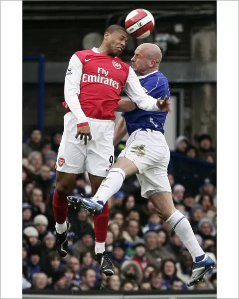 Evertons Carsley challenges Arsenals Baptista for the ball during their English Premier League soc