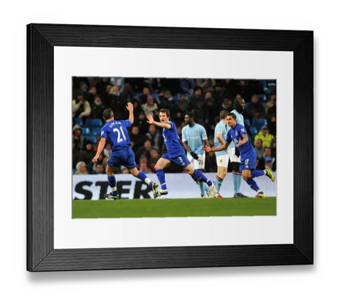 Framed Print : Everton's Triumphant Trio: Tim Cahill, Leon Osman, and Leighton Baines Celebrate Second Goal vs. Manchester City (2010)