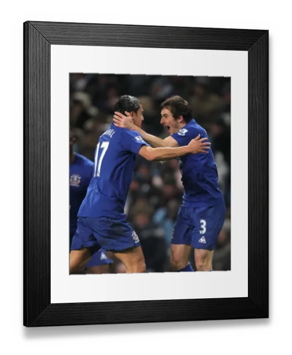 Framed Print : Everton's Unforgettable Double Strike: Tim Cahill and Leighton Baines Euphoric Celebration (December 2010)