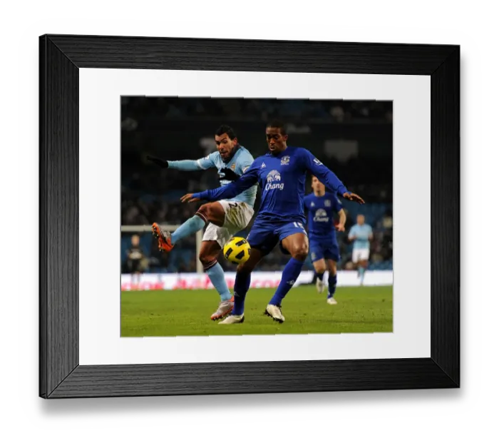 Framed Print : Manchester Derby Showdown: Distin vs Tevez - A Battle for Premier League Supremacy (Dec 2010) Framed Print : Manchester Derby Showdown: Distin vs Tevez - A Battle for Premier League Supremacy (Dec 2010)