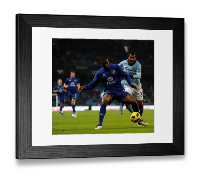 Framed Print : Manchester Derby Showdown: Distin vs Tevez - A Football Rivalry Framed Print : Manchester Derby Showdown: Distin vs Tevez - A Football Rivalry