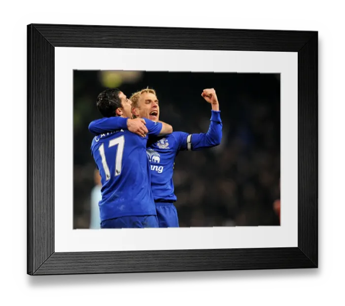 Framed Print : Everton's Glory: Tim Cahill and Phil Neville's Victory Celebration over Manchester City (2010)
