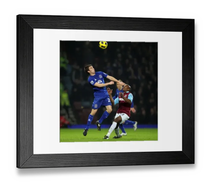 Framed Print : Battle for the Ball: Seamus Coleman vs. Luis Boa Morte - Everton vs. West Ham United, Premier League (Upton Park, 2010)