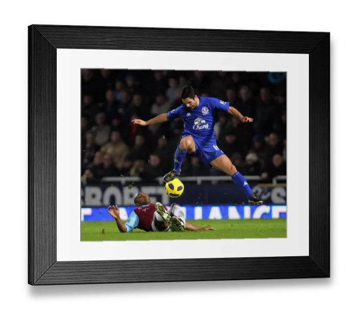 Framed Print : Intense Battle: Mikel Arteta vs. Luis Boa Morte - Unforgettable Tackle in the Barclays Premier League Clash between West Ham United and Everton (December 2010, Upton Park)