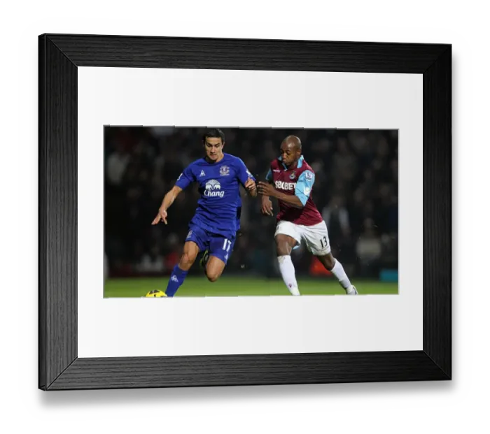 Framed Print : Clash at Upton Park: Tim Cahill vs Luis Boa Morte - Everton vs West Ham United, Premier League Showdown (26 December 2010) Framed Print : Clash at Upton Park: Tim Cahill vs Luis Boa Morte - Everton vs West Ham United, Premier League Showdown (26 December 2010)