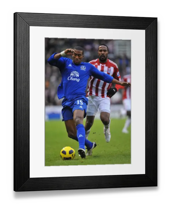 Framed Print : Distin vs. Fuller: A Football Battle at Britannia Stadium - Everton vs. Stoke City, Barclays Premier League (01.01.2011)