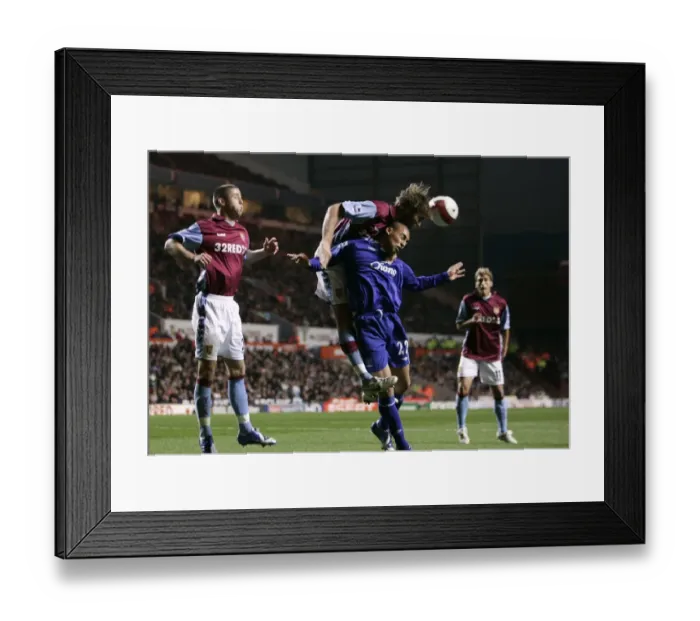 Framed Print : Aston Villa v Everton James Vaughan in action against Olof Mellberg