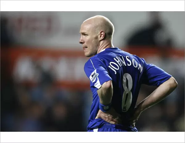 Evertons Johnson holds his side after their English Premier League soccer match against Aston Villa