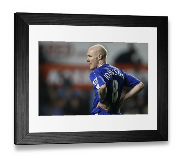 Framed Print : Evertons Johnson holds his side after their English Premier League soccer match against Aston Villa Framed Print : Evertons Johnson holds his side after their English Premier League soccer match against Aston Villa