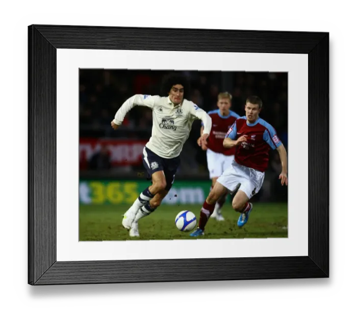 Framed Print : Clash of Giants: Fellaini vs. O'Connor - Everton's Showdown at Scunthorpe United's Glanford Park, FA Cup Third Round Framed Print : Clash of Giants: Fellaini vs. O'Connor - Everton's Showdown at Scunthorpe United's Glanford Park, FA Cup Third Round