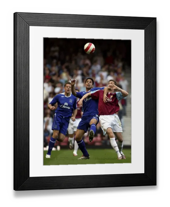 Framed Print : West Ham United v Everton George McCartney and Mikel Arteta