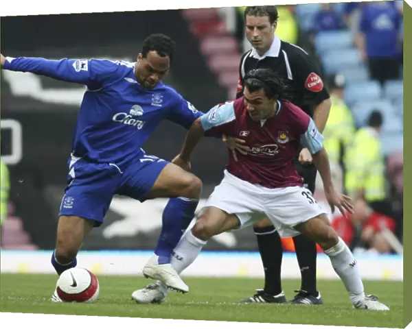 West Ham United v Everton Carlos Tevez with Joleon Lescott