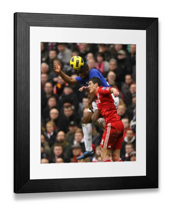 Framed Print : Intense Rivalry: Anichebe vs. Kelly at Anfield - Liverpool vs. Everton, Barclays Premier League (16 January 2011)