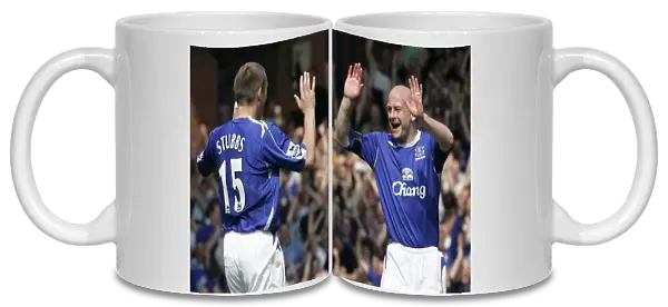 Evertons Stubbs celebrates with Carsley after scoring against Manchester United in Liverpool