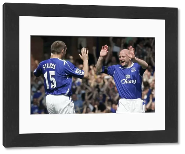 Evertons Stubbs celebrates with Carsley after scoring against Manchester United in Liverpool