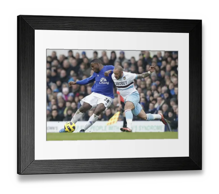 Framed Print : Faubert vs. Anichebe: A Battle at Goodison Park - Everton vs. West Ham United, Barclays Premier League (22 January 2011)