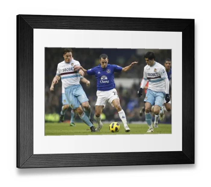 Framed Print : Battle at Goodison Park: Osman's Intense Clash with Parker and Tomkins (Everton vs. West Ham United, Barclays Premier League, 2011) Framed Print : Battle at Goodison Park: Osman's Intense Clash with Parker and Tomkins (Everton vs. West Ham United, Barclays Premier League, 2011)
