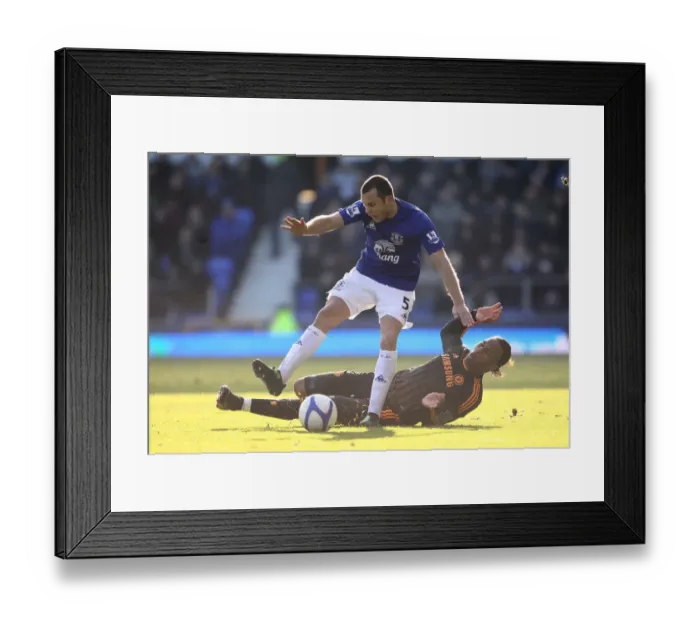 Framed Print : Heating Up the Pitch: A Fierce Battle Between Heitinga and Drogba in the FA Cup Fourth Round Clash between Everton and Chelsea (29 January 2011) Framed Print : Heating Up the Pitch: A Fierce Battle Between Heitinga and Drogba in the FA Cup Fourth Round Clash between Everton and Chelsea (29 January 2011)