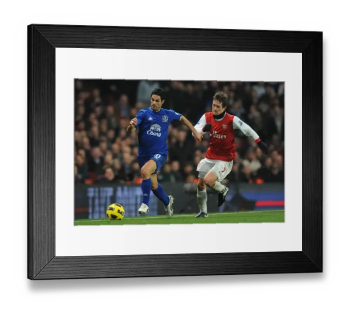 Framed Print : Intense Battle: Mikel Arteta Evades Tomas Rosicky at Emirates Stadium - Arsenal vs. Everton, Barclays Premier League (February 2011)