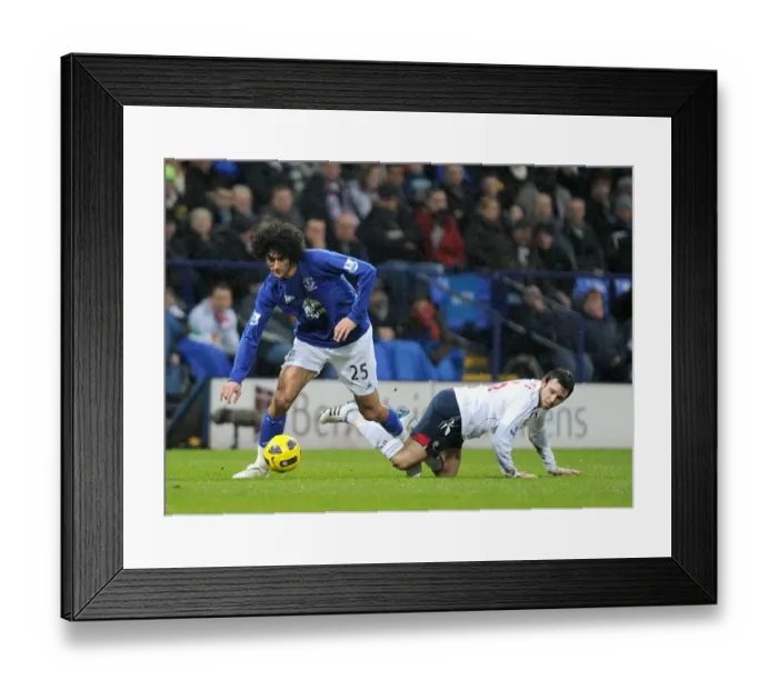 Framed Print : Fellaini vs. Davies: A Premier League Showdown at Reebok Stadium (13 February 2011)