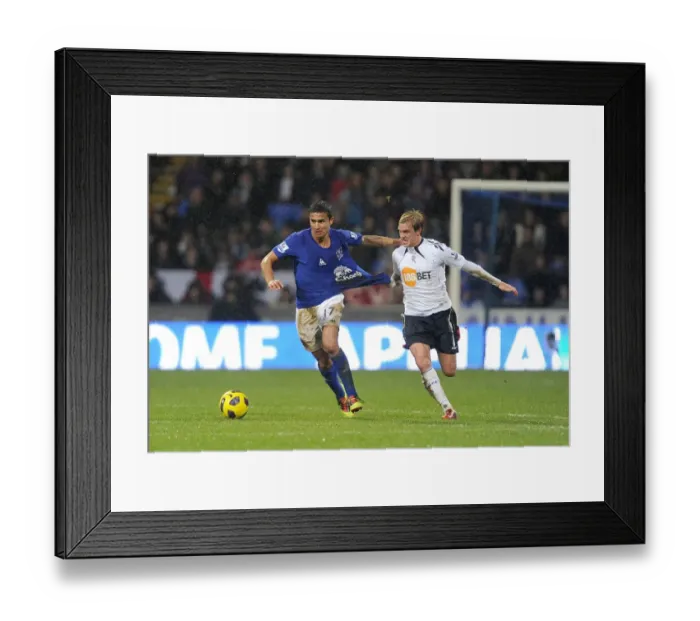 Framed Print : Intense Rivalry: Cahill vs. Holden's Battle for Ball Possession - Everton vs. Bolton Wanderers, Barclays Premier League (2011) Framed Print : Intense Rivalry: Cahill vs. Holden's Battle for Ball Possession - Everton vs. Bolton Wanderers, Barclays Premier League (2011)