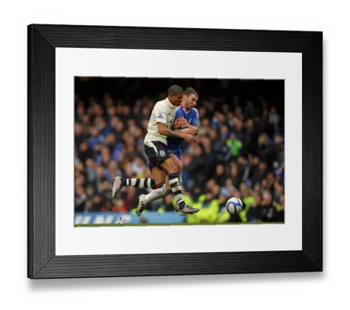 Framed Print : Battle for the Ball: Jermaine Beckford vs. Branislav Ivanovic - FA Cup Fourth Round Replay, Chelsea vs. Everton (19 February 2011)