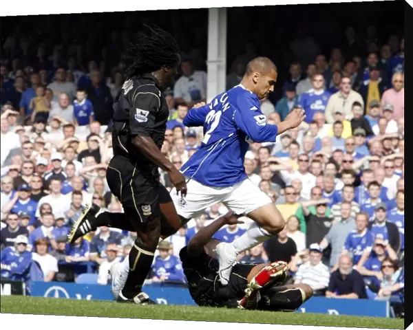 Everton v Portsmouth - James Vaughan is brought down in the box to win a penalty