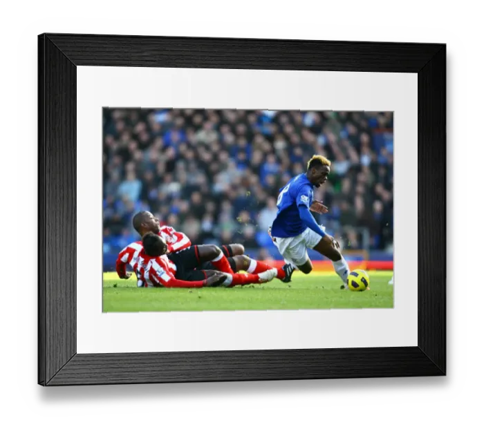 Framed Print : Everton's Louis Saha Foul by Sunderland's Titus Bramble and John Mensah (Barclays Premier League, 26 February 2011, Goodison Park) Framed Print : Everton's Louis Saha Foul by Sunderland's Titus Bramble and John Mensah (Barclays Premier League, 26 February 2011, Goodison Park)