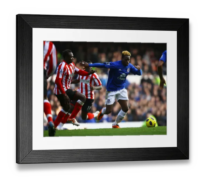 Framed Print : Battle for the Ball: Saha vs Mensah - Everton vs Sunderland's Intense Rivalry (Barclays Premier League, 26 February 2011) Framed Print : Battle for the Ball: Saha vs Mensah - Everton vs Sunderland's Intense Rivalry (Barclays Premier League, 26 February 2011)