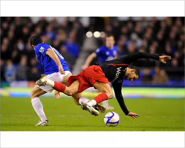 Mikel Arteta vs. Jobi McAnuff: A Battle for the Ball in Everton's FA Cup Fifth Round Clash (01 March 2011)