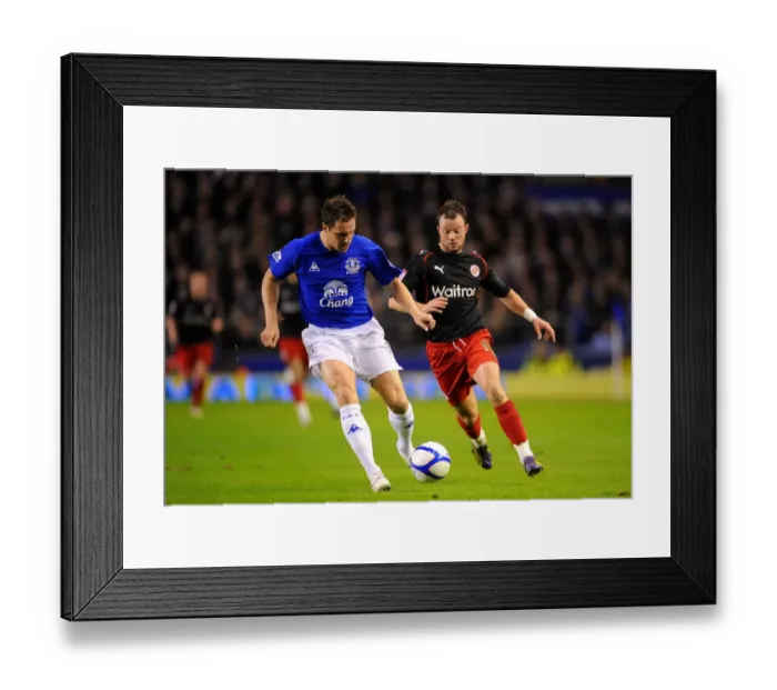 Framed Print : Battle for the Ball: Jagielka vs. Hunt - Everton's FA Cup Fifth Round Intense Rivalry (March 1, 2011)
