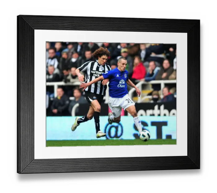 Framed Print : Battle for Supremacy: Osman vs. Coloccini - Everton vs. Newcastle United, Premier League (05 March 2011)