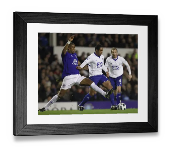 Framed Print : Intense Rivalry: Distin vs Beausejour at Goodison Park - Everton vs Birmingham City, Barclays Premier League (09 Mar 2011) Framed Print : Intense Rivalry: Distin vs Beausejour at Goodison Park - Everton vs Birmingham City, Barclays Premier League (09 Mar 2011)