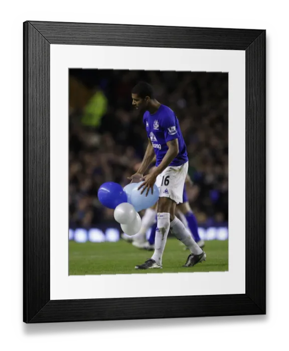 Framed Print : Everton's Jermaine Beckford: Popping Balloons in Triumph after Scoring against Birmingham City (09.03.2011, Goodison Park) Framed Print : Everton's Jermaine Beckford: Popping Balloons in Triumph after Scoring against Birmingham City (09.03.2011, Goodison Park)