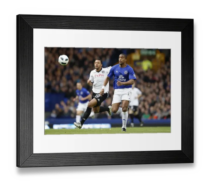 Framed Print : Intense Rivalry: Dembele vs. Distin - Everton vs. Fulham's Premier League Showdown at Goodison Park (19 March 2011) Framed Print : Intense Rivalry: Dembele vs. Distin - Everton vs. Fulham's Premier League Showdown at Goodison Park (19 March 2011)